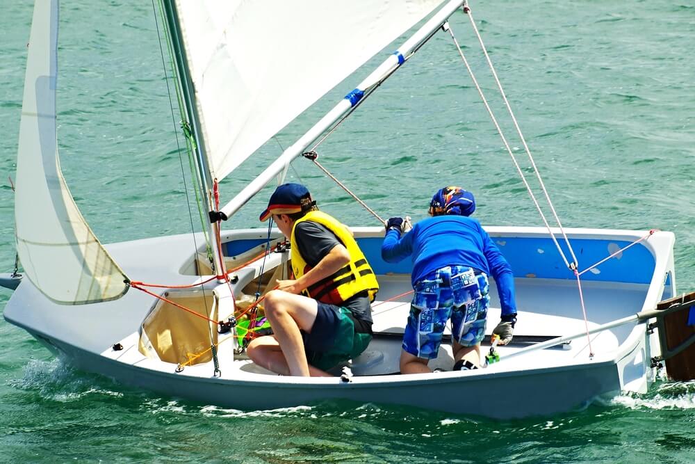 two people learning to sail on small sailboat-windward seaventure
